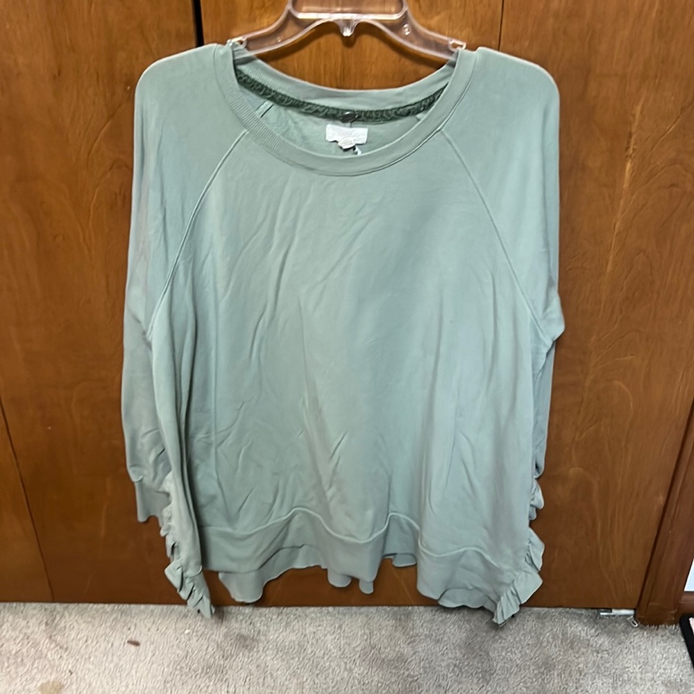 Green long sleeve Cupio shirt, W/ Cute ruffle slits on the sides.